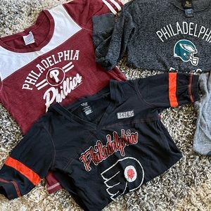 Philadelphia sports team graphic shirts.